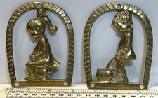 Two Comical Brass Toilet Signs
