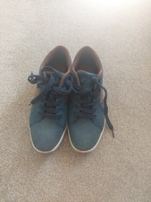 A Pair Of Men's Canvas Shoes