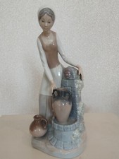 Nao large figurine. Girl at water well fountain with water jugs.