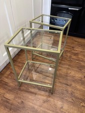 Two glass side tables