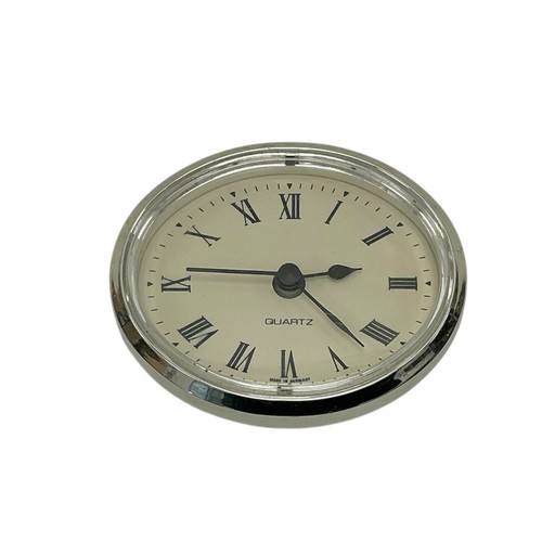 Silver oval quartz clock - oval,