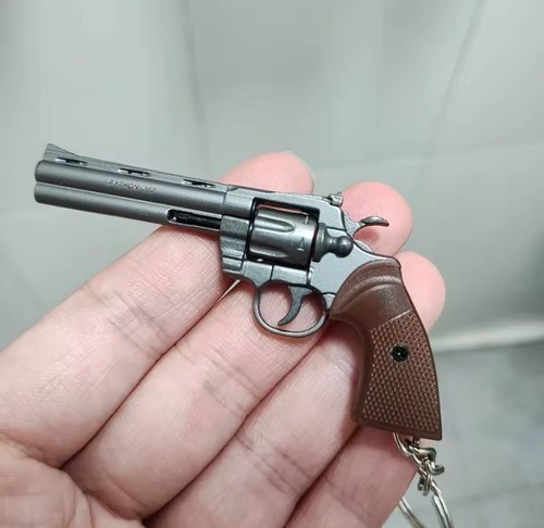 Scale grey revolver gun - scale,