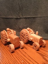 2 wooden toy tractors