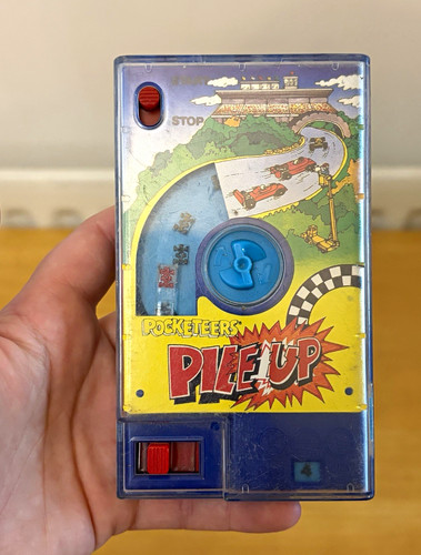 Tomy handheld electronic game - tomy,