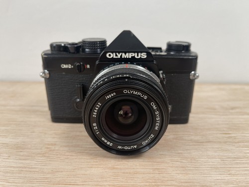 Olympus camera with 28 - om-2n,