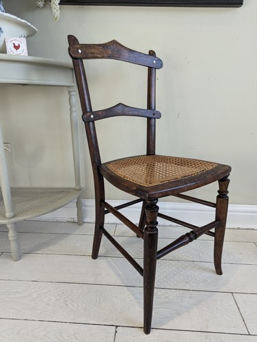 Cane seated antique chair - seated,