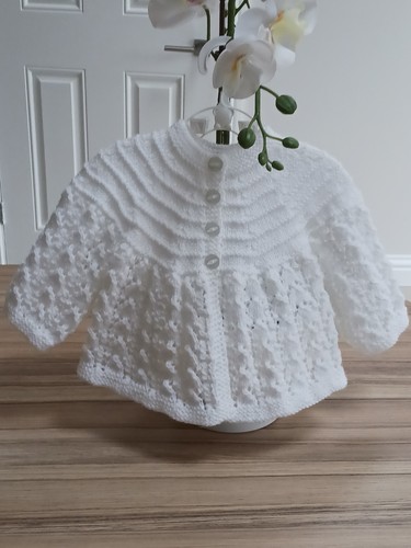 White hand knitted baby - hand,