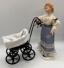 Dolls house large wicker pram in 1/12th Scale. 