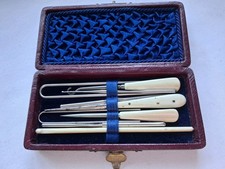 Vintage crochet hooks etc in a