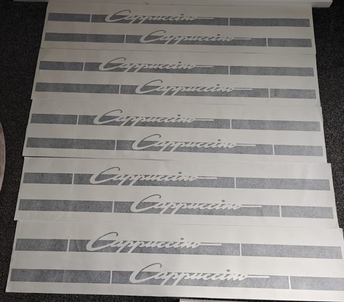 Suzuki cappuccino side - side, logo