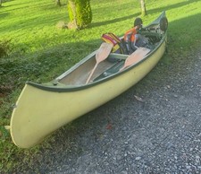 Open canoe, 14ft Long With Two Buoyancy aids, Two Wooden Paddles And A Wheel Set
