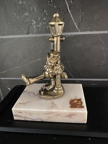 Drunk man holding onto brass - drunk,