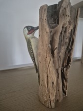 Hand Carved Woodpecker On Log