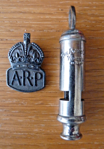 Arp badge with an - badge,