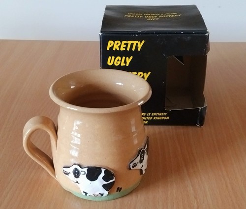 Pretty ugly pottery mug hand - ugly,