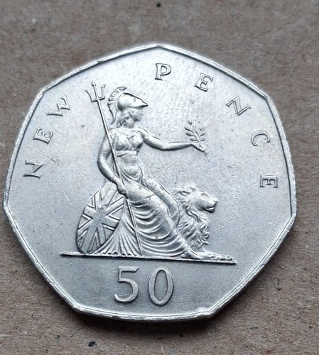 Large old style 50p coin - style,