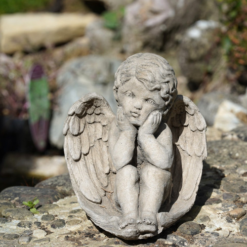 Thoughtful cherub stone statue - cherub,