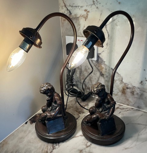 Pair spelter bronzed seated - of,