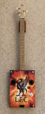 Cigar box guitar with logo