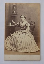 CDV OF LADY HOLDING A