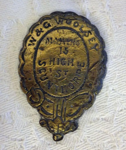 Antique brass trade label g - trade, w&g