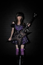Guitarist Jacqueline Mannering with a Dean Razorback guitar at the- Old Photo