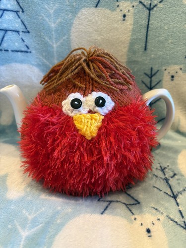 New hand knitted robin - hand,