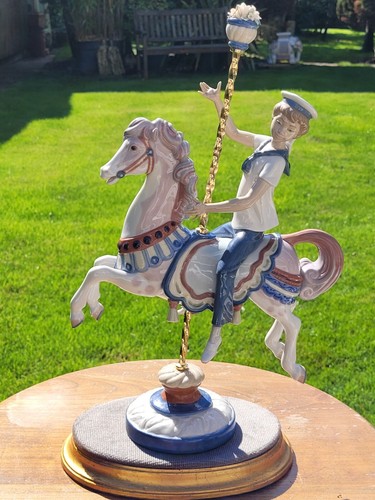 Lladro boy on carousel - on,