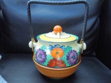 A Clarice Cliff biscuit barrel in GAY DAY pattern.