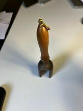 Unusual curved horseshoe magnet with wooden handle