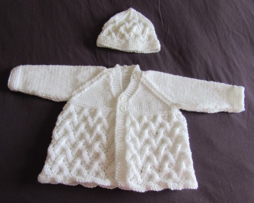 Hand knitted patterned matinee