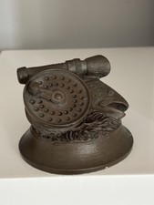 David Hughes Fish Sculpture bronze resin fish with a fishing reel on its head