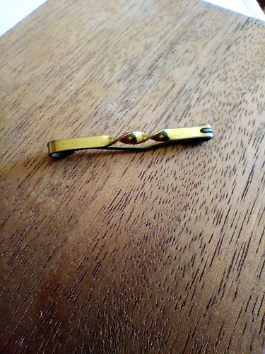 Gilt metal tie - tie, side