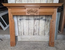 A RECLAIMED VINTAGE PINE FIRE SURROUND WITH CARVED DETAILING FS0411