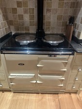 AGA COOKER 2 OVEN DELUXE OIL FIRED MODEL IN PASTAL CREAM