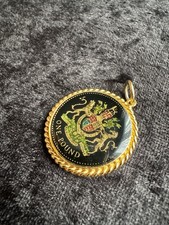 vintage gilded enamelled pound