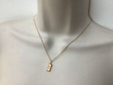 A VINTAGE 9ct GOLD INGOT PENDANT SUSPENDED ON AN 18” CURB LINK CHAIN IN VGC.