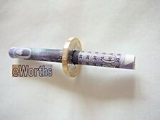 CIGARETTE  THROUGH  £1  COIN