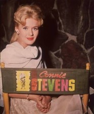 Singer & actress Connie Stevens sits canvas chair which has name bac- Old Photo