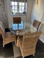 Glass Topped Dining Table with Interesting Teak Root Base and 6 Rattan Chairs