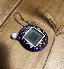 2007 Tamagotchi V4  Transparent Purple Snow Working English