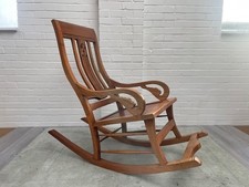 Ornate Carved Teak Rocking