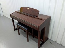 Yamaha Clavinova CLP-150 digital piano and stool in mahogany stock #25337