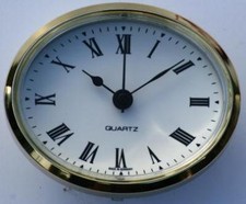 Oval Clock Suitable for Caravans, Motorhomes and Boats White Roman brass bezel.