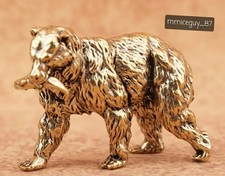 A Vintage Brass Bear Holding