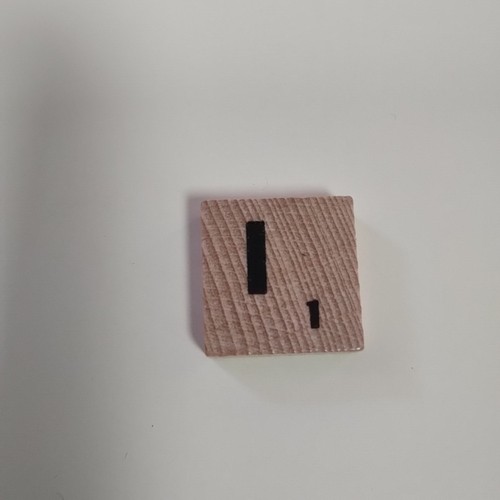 Light wooden scrabble tiles - light,