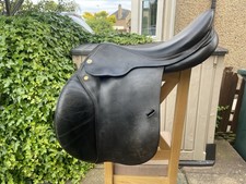 Prestige Gold Star jump saddle. Black with tan and cream piping.17” Medium width