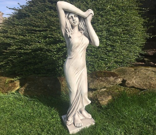 Concrete nude girl sculpture