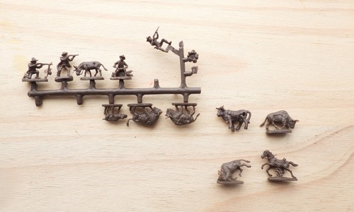 Miniature soldiers cowboys - soldiers.,