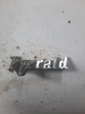 Triumph Herald badge vintage chrome
